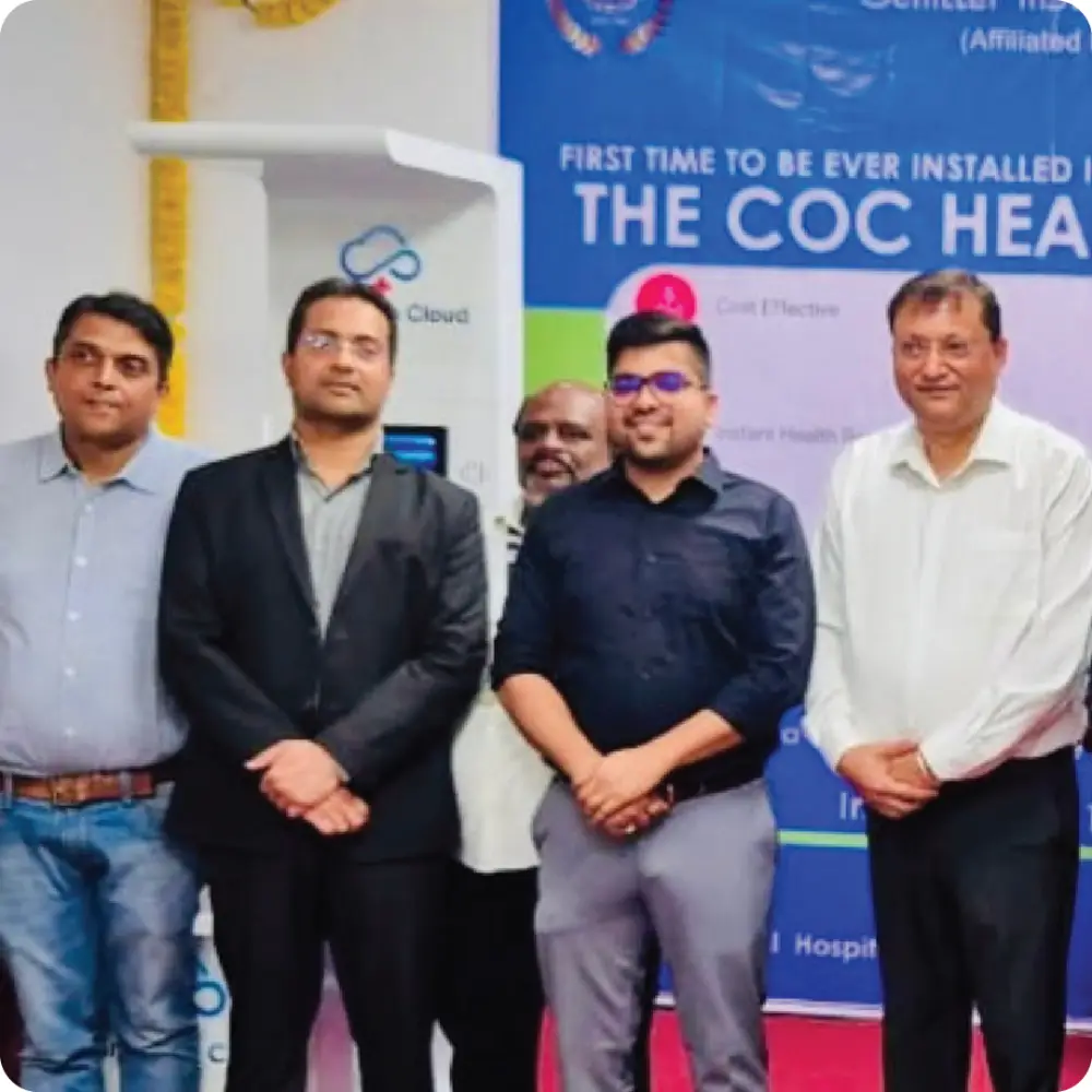 The team in front of a Health ATM installation banner