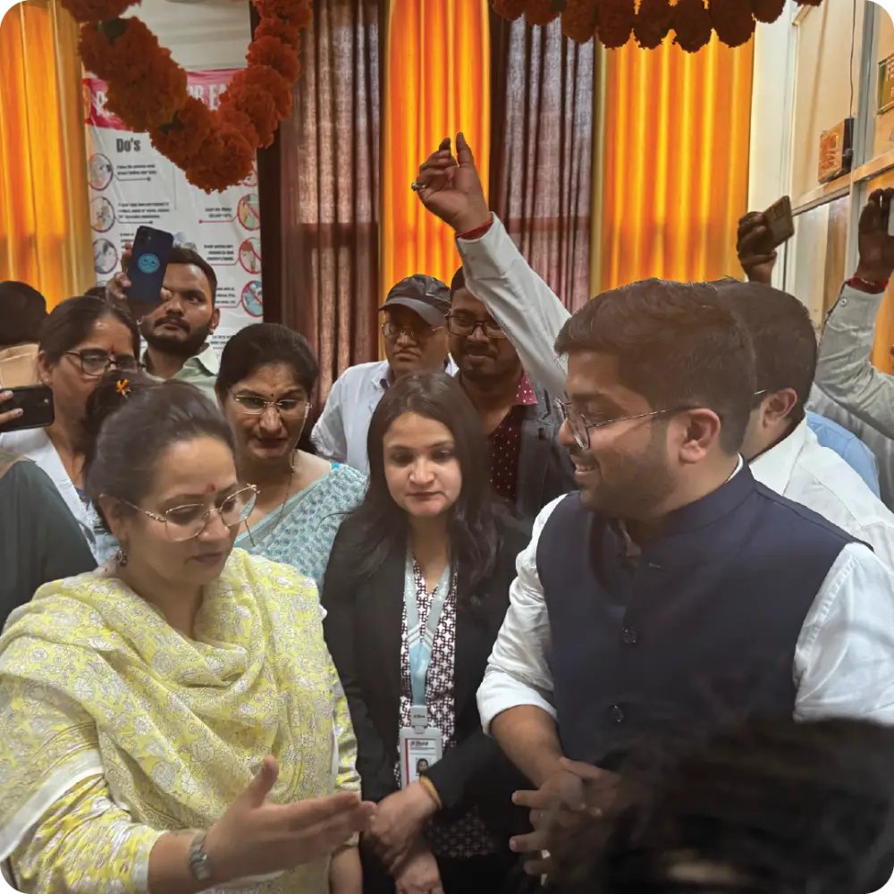 Abhay Agarwal with a family at a screening event