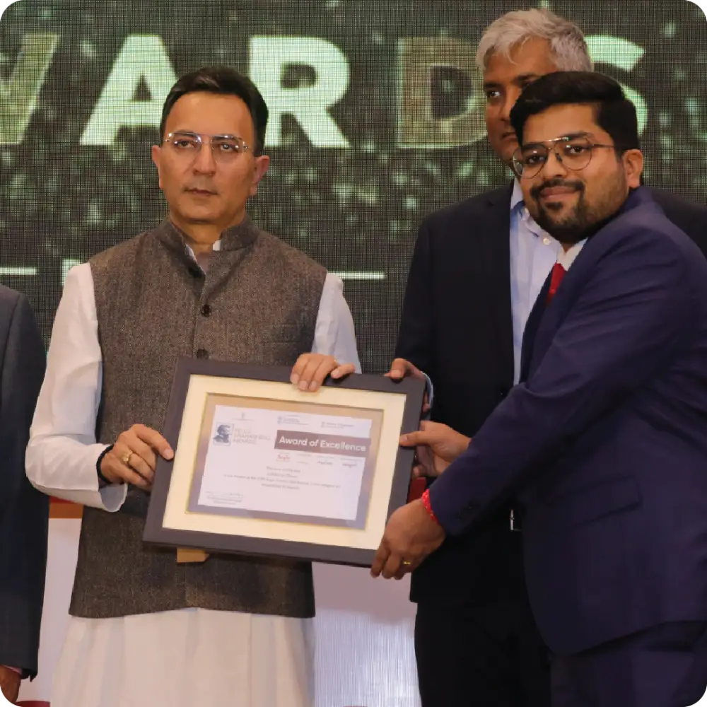 Abhay Agarwal receiving a framed award
