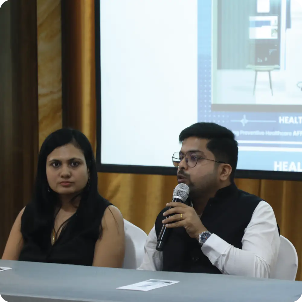 Abhay Agarwal speaking into a microphone on a panel