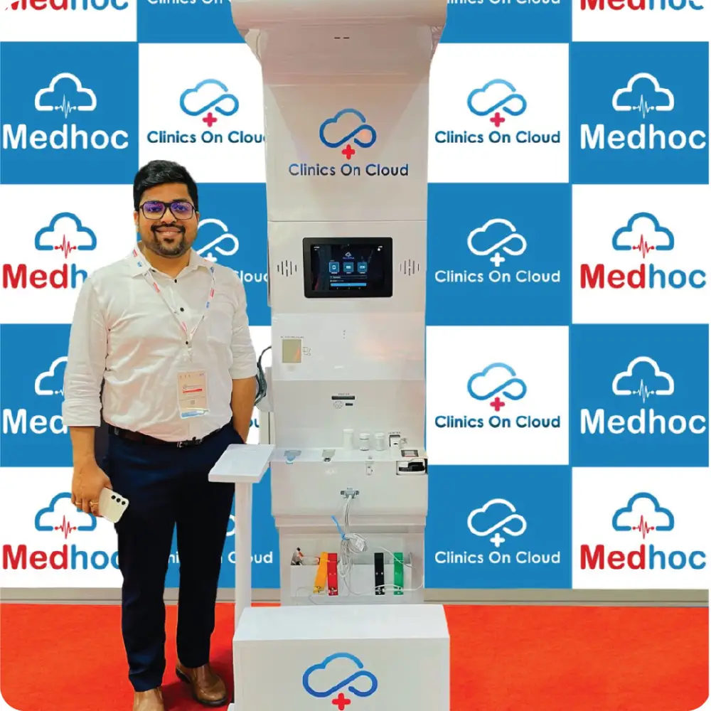 A Health ATM on a partner stand, three people beside it
