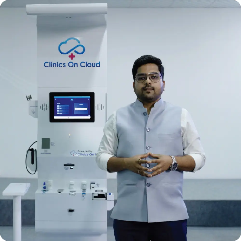 Abhay Agarwal standing beside a Health ATM