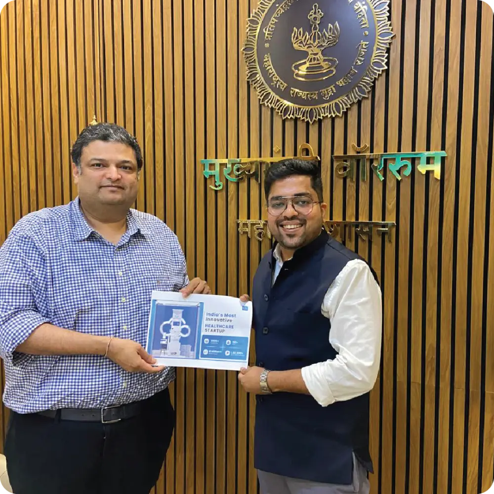 Abhay Agarwal handed a framed certificate
