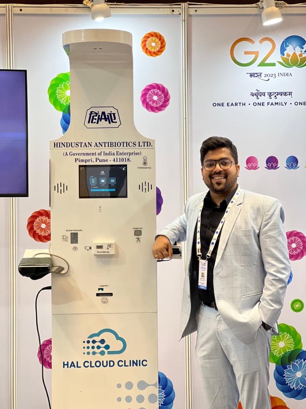 Abhay Agarwal beside a Health ATM at an exhibition