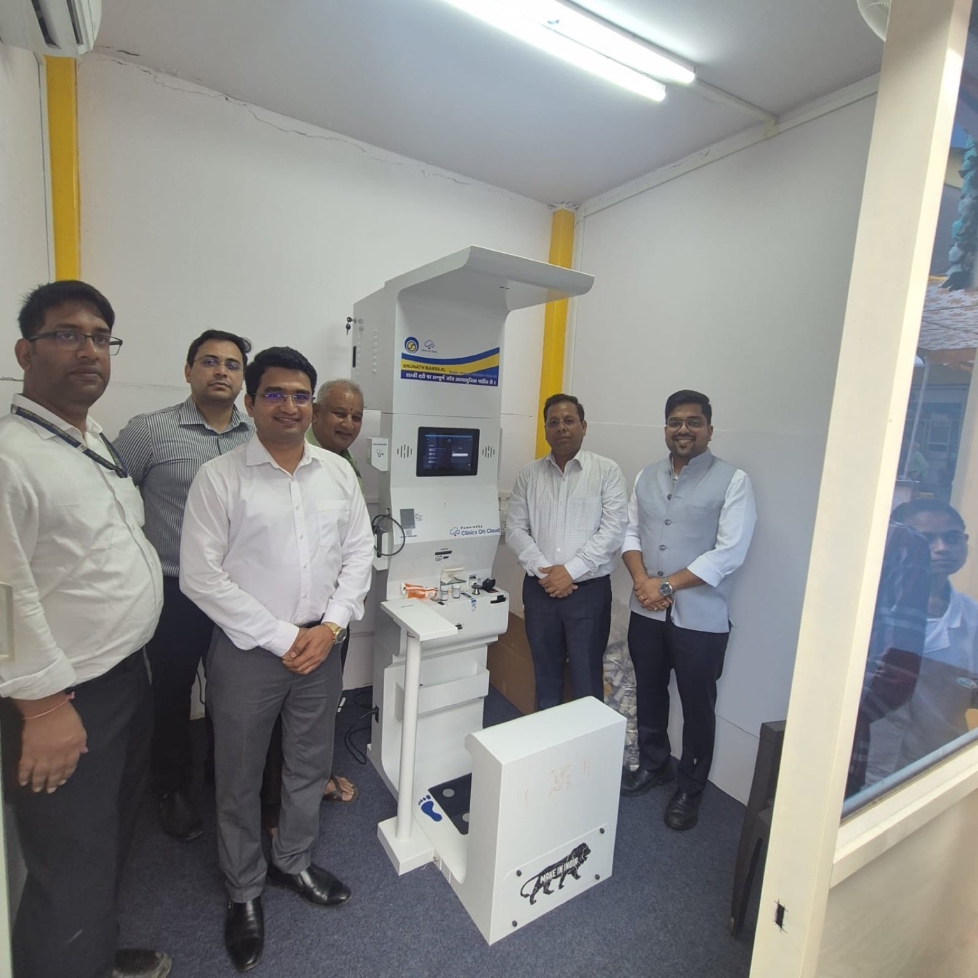 A handover beside a Health ATM